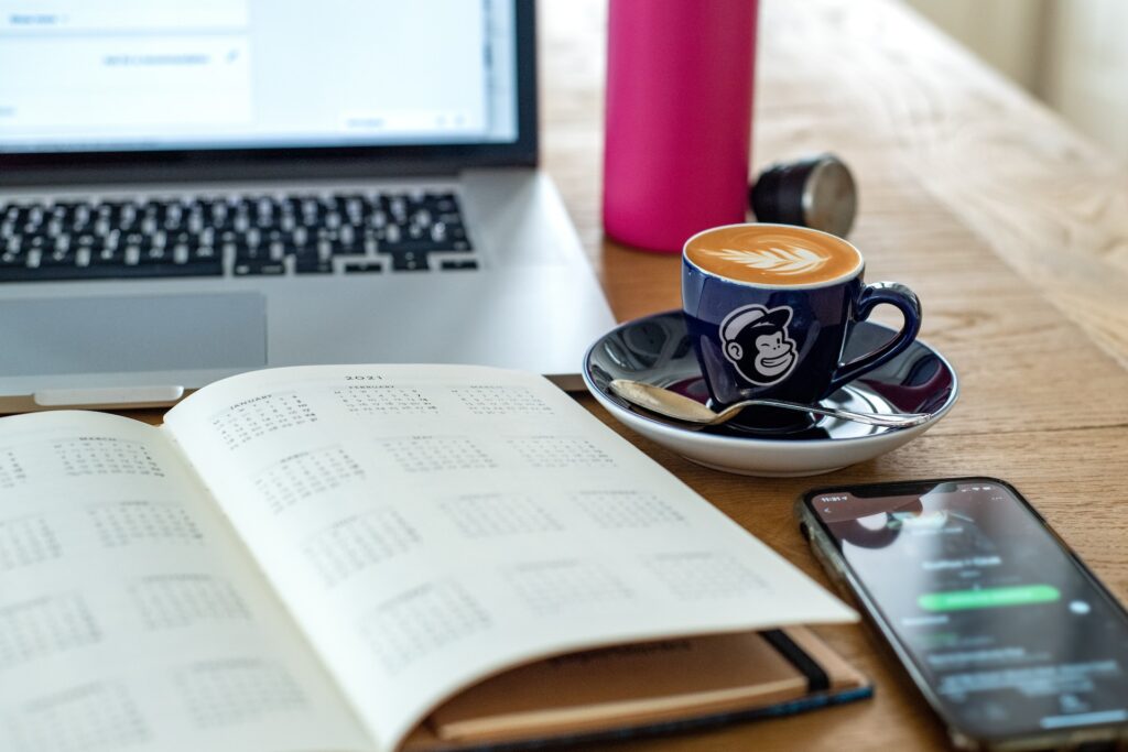 business materials with mailchimp cup